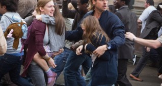 Mireille Enos is Karin (center left), Sterling Jerins is Connie, and Brad Pitt (center right) is Gerald Lane in WORLD WAR Z, from Paramount Pictures and Skydance Productions in association with Hemisphere Media Capital and GK Films. Photo credit: Jaap Buitendijk. (c) 2012 Paramount Pictures. All Rights Reserved.